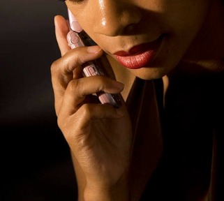Stock photo of African-American woman talking on cellphone looking depressed.